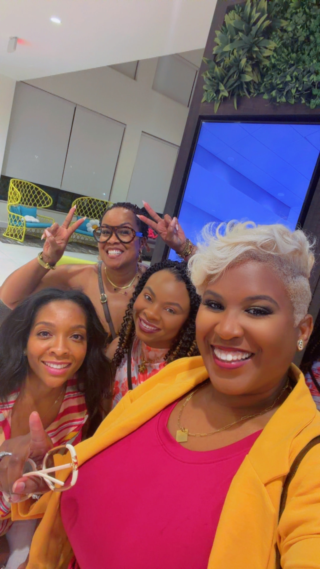 Four Black FRMs Connect community members smiling together in a group selfie